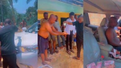 "No value" – Nigerian big boy washes father's hand with expensive alcohol as he gifts him an SUV