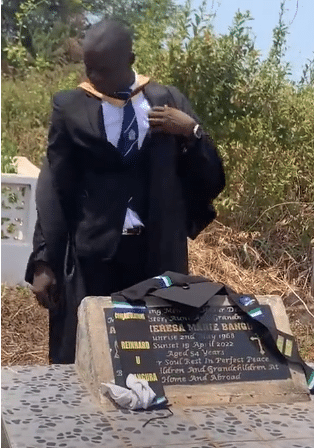 man graduation mother's grave
