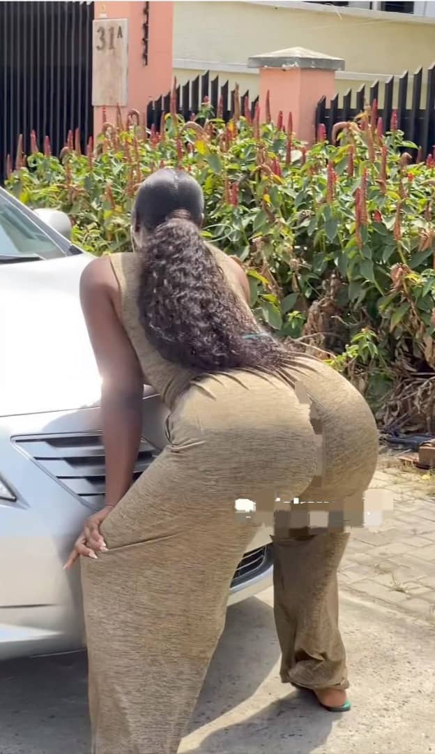 Lady shows off her car in a seductive manner