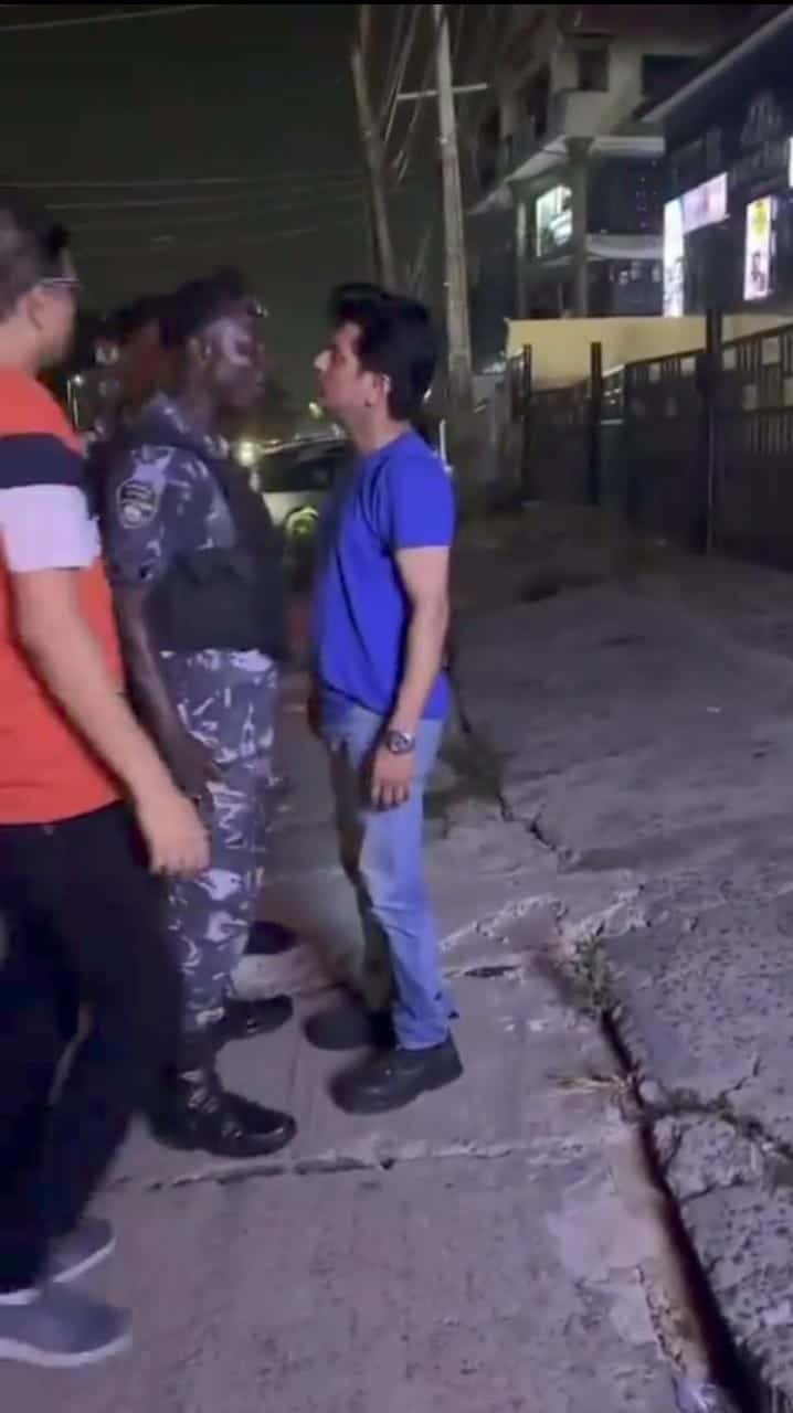 Altercation between Nigerian police and an Indian man