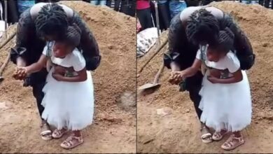 Little girl weeps at mother's funeral