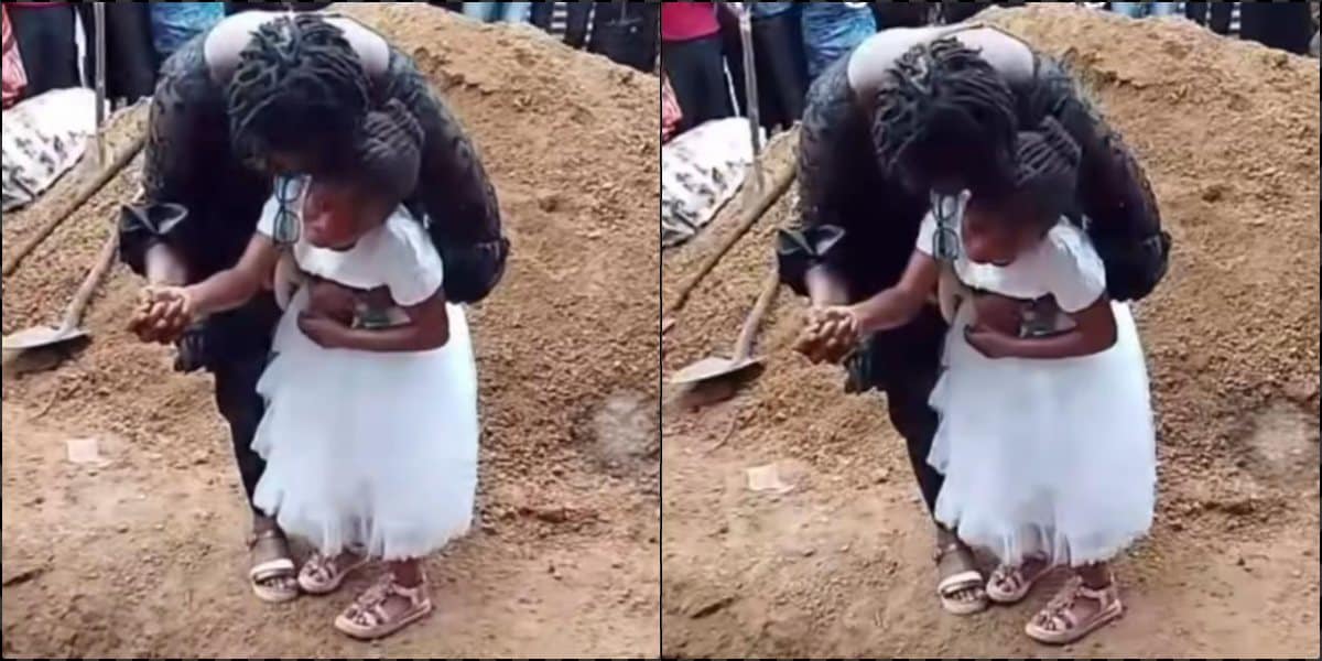 Little girl weeps at mother's funeral