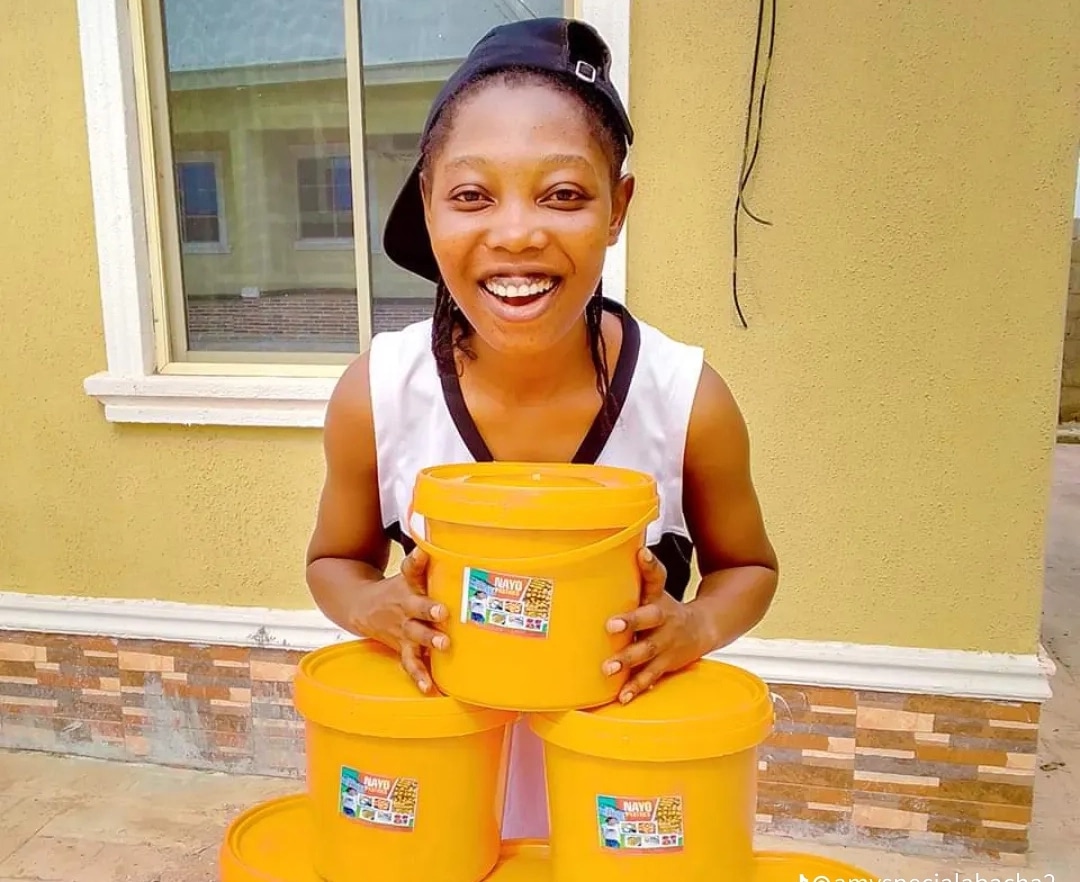 Nigerian lady’s hard work pays off as she opens own shop after years of hawking chin chin, egg rolls, puff puff
