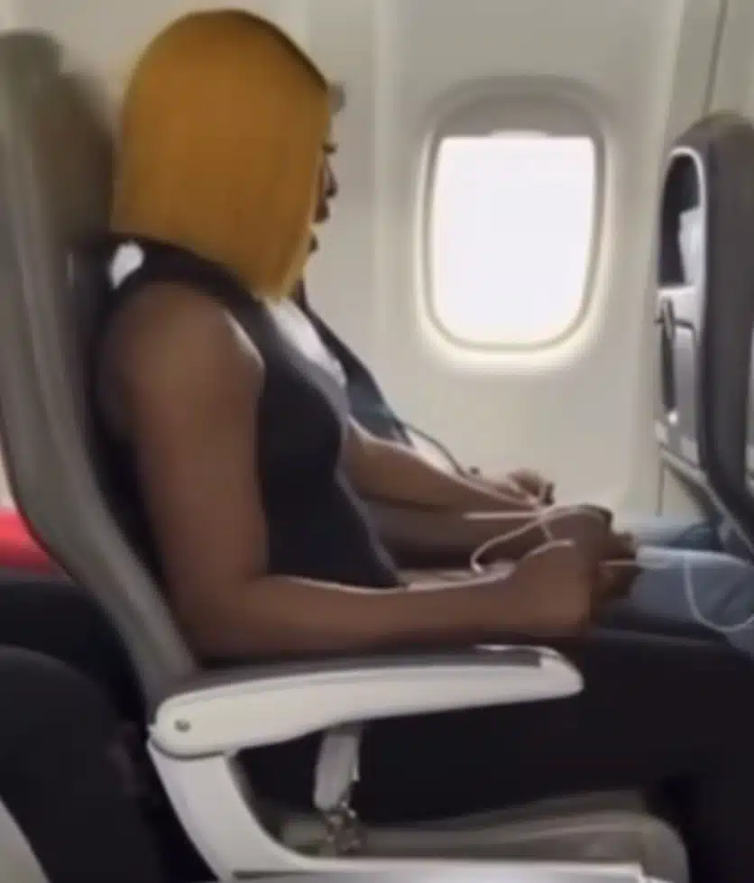 Lady panics as she flies on a plane for the first time