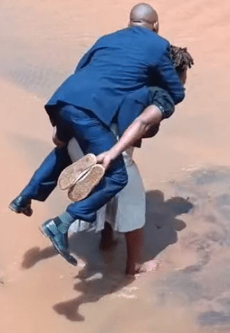 "True love?" - Video of woman carrying her man on her back while crossing muddy road causes buzz online