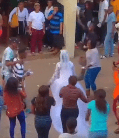 Moment bride arrives school in wedding gown to write her final exam