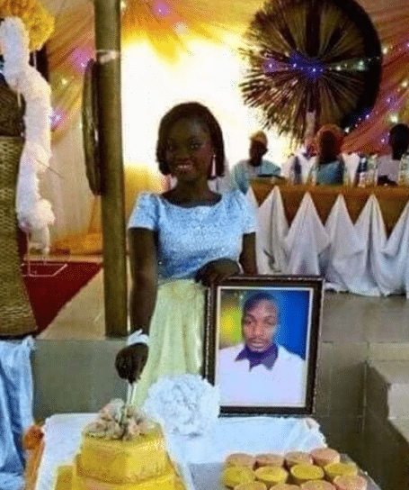 Lady causes stir as she marries photo of lover who claimed to be too busy for wedding