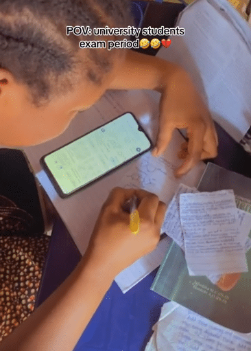 Lady stirs outrage as she’s spotted preparing to cheat in her exam