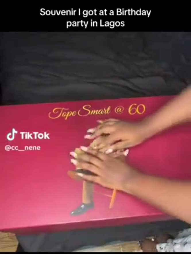 Lady displays unusual souvenir she received at a birthday party
