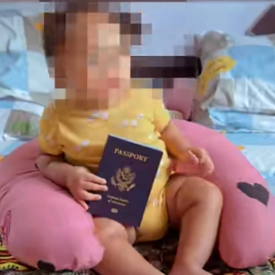 Nigerian mother shares joy, flaunts blue passport as baby son becomes American citizen