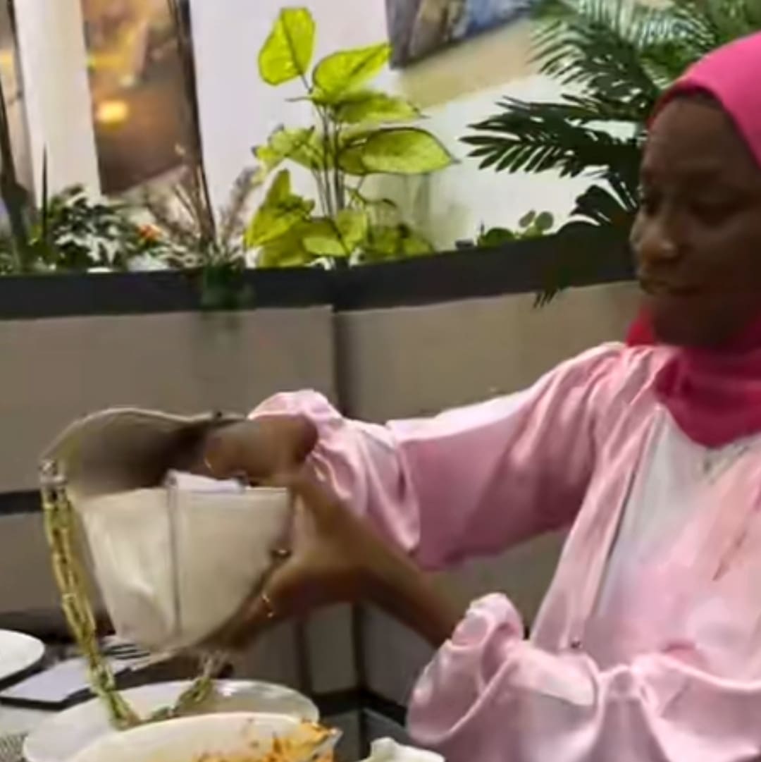 Nigerian lady saves leftover stew in water bottle, takes it home after finishing rice from ₦10k meal