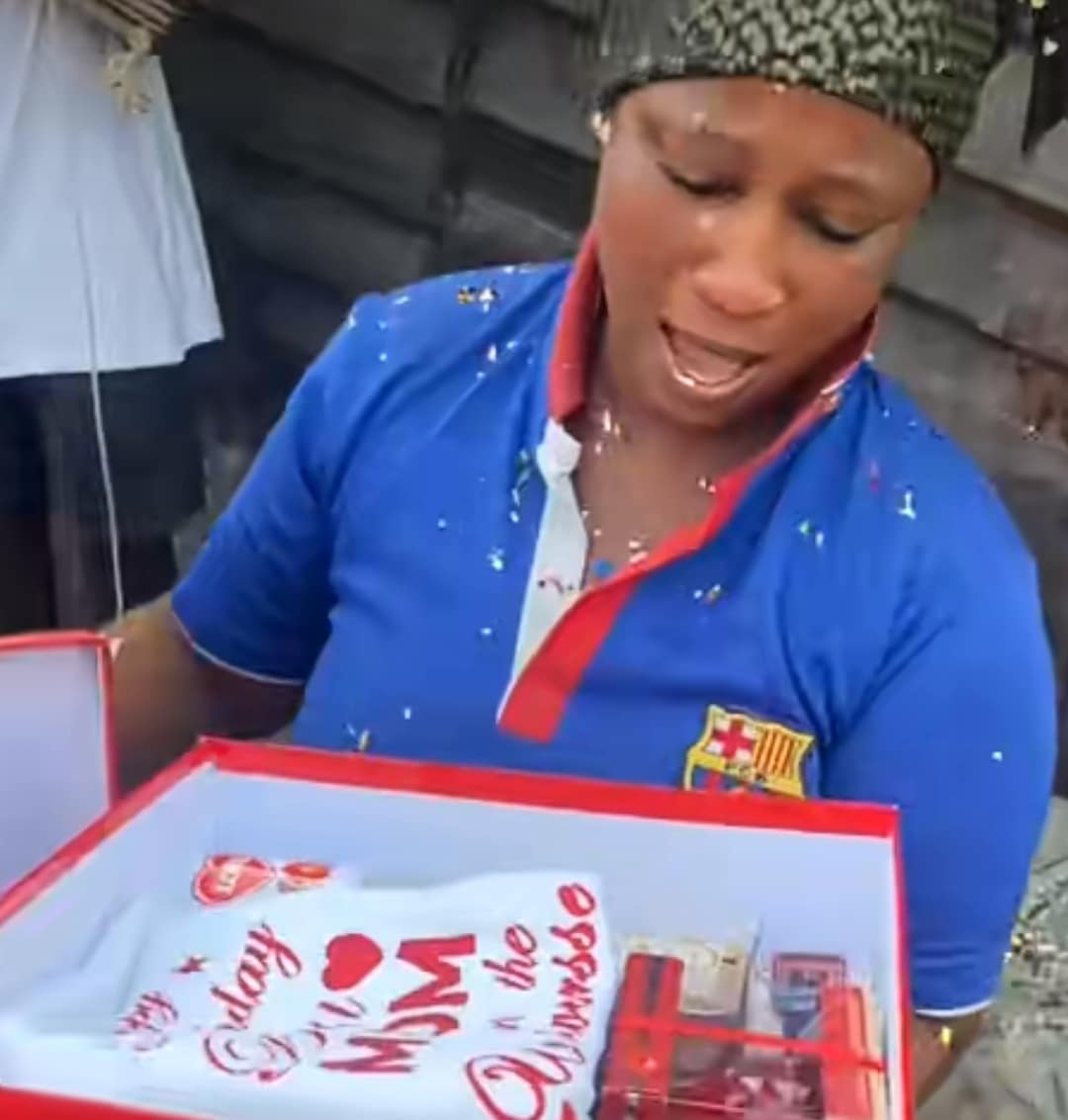 Nigerian charcoal-selling mother overwhelmed with emotion as son surprises her with gifts on birthday
