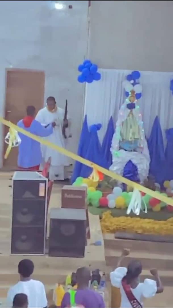 Church member lauds Reverend Father as he shoots a gun during service