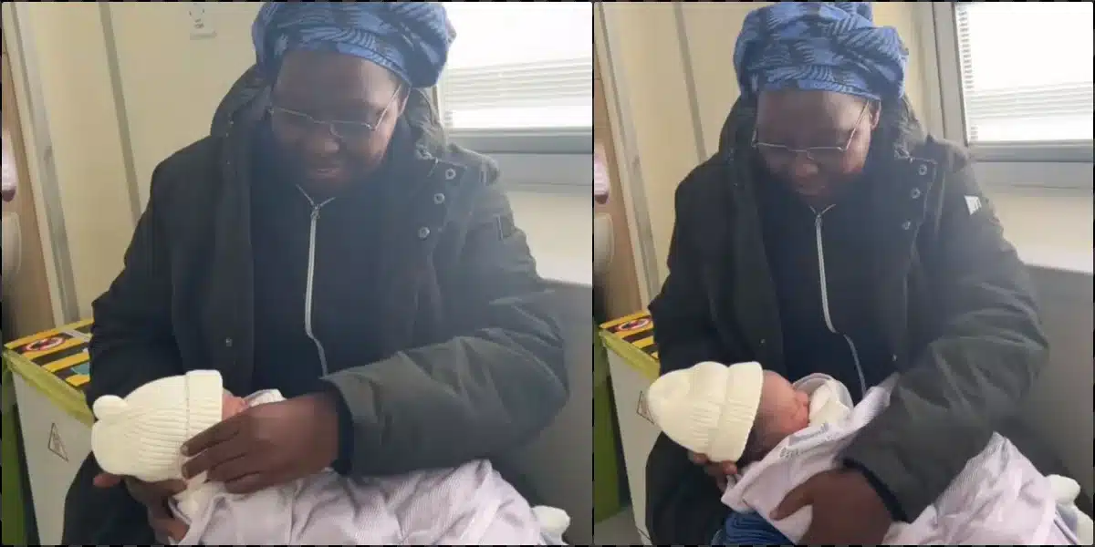 Emotional moment mother carries grandchild for the first time