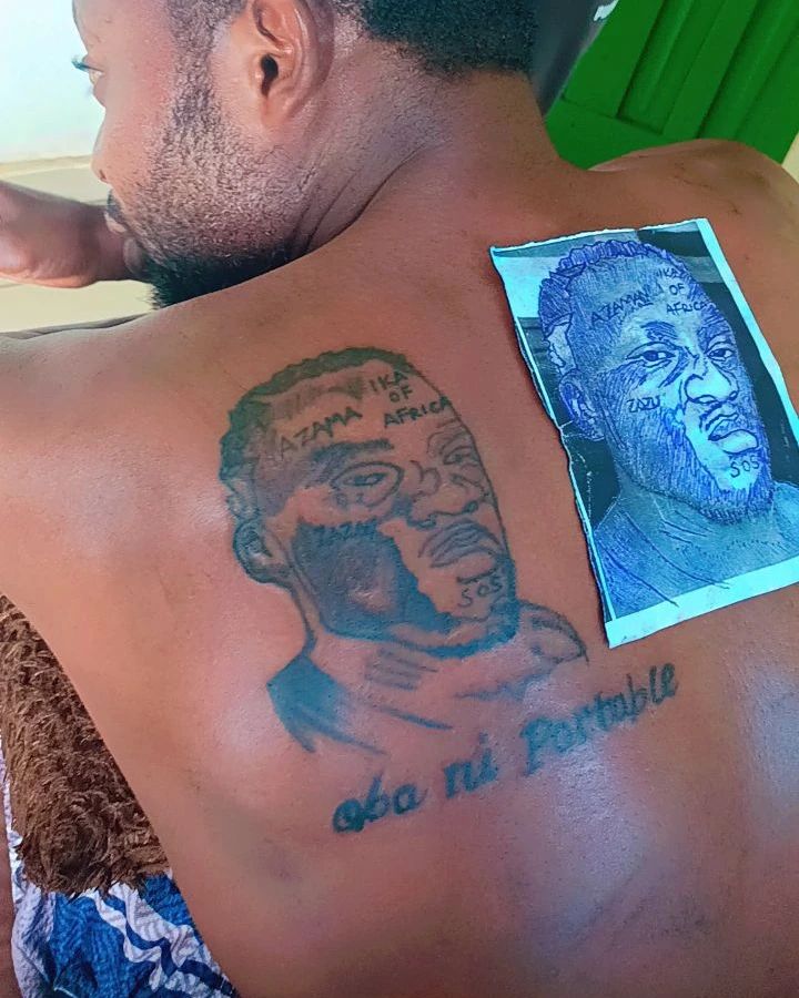 Portable blesses fan for inking tattoo of his face 
