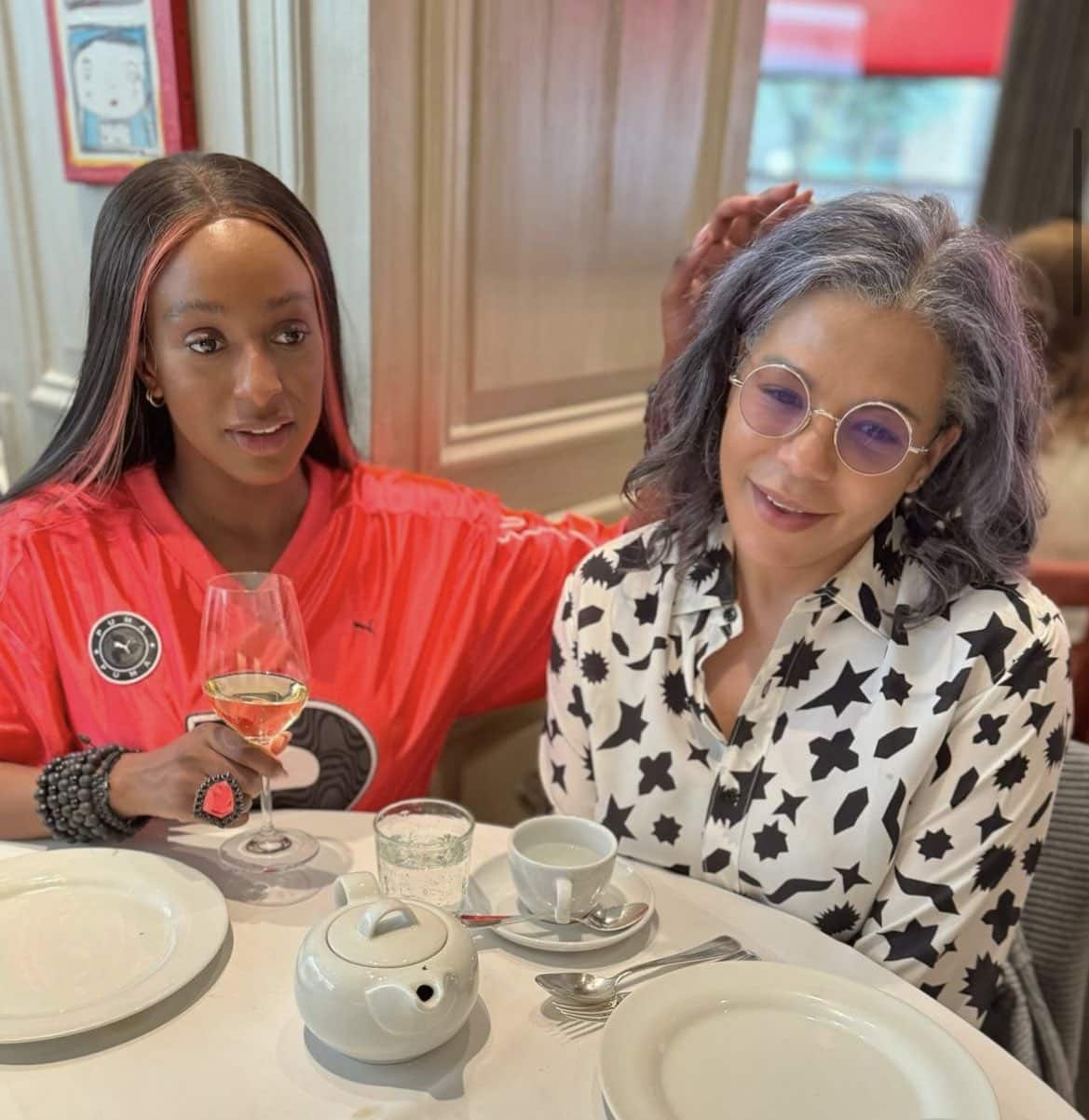 DJ Cuppy alongside her mother