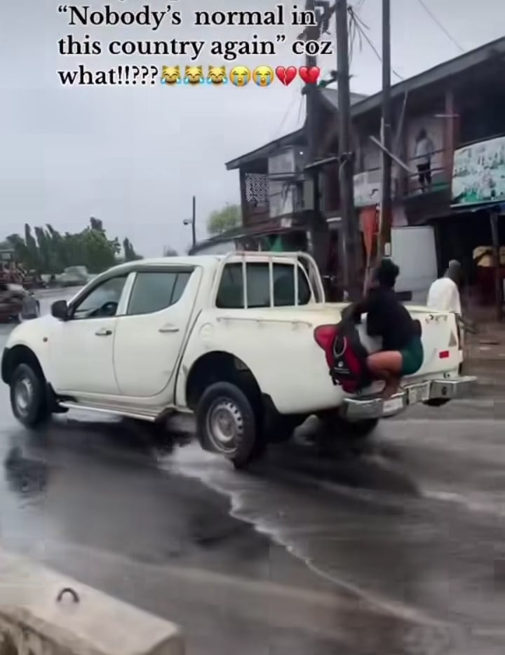 Lady truck flooded road 
