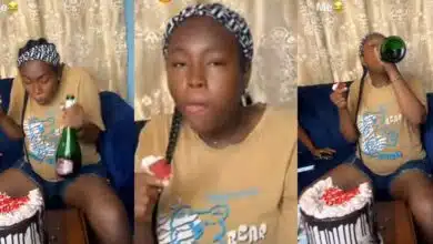 Nigerian lady eats big cake alone on birthday after friends, guests fail to show up