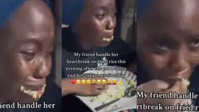 Nigerian lady feeds herself rice while crying as boyfriend ends 3-year relationship