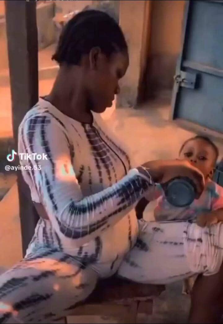 Netizens outraged as lady feeds beer to her little baby