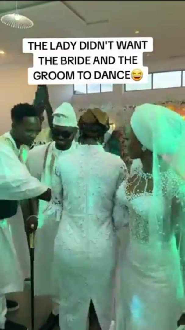Drama as lady prevents groom from dancing with his bride on their wedding day