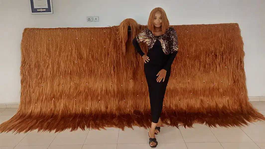 Nigerian lady record widest wig 