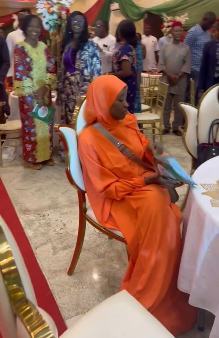 Aisha Yesufu refuses to stand during recitation of new national anthem