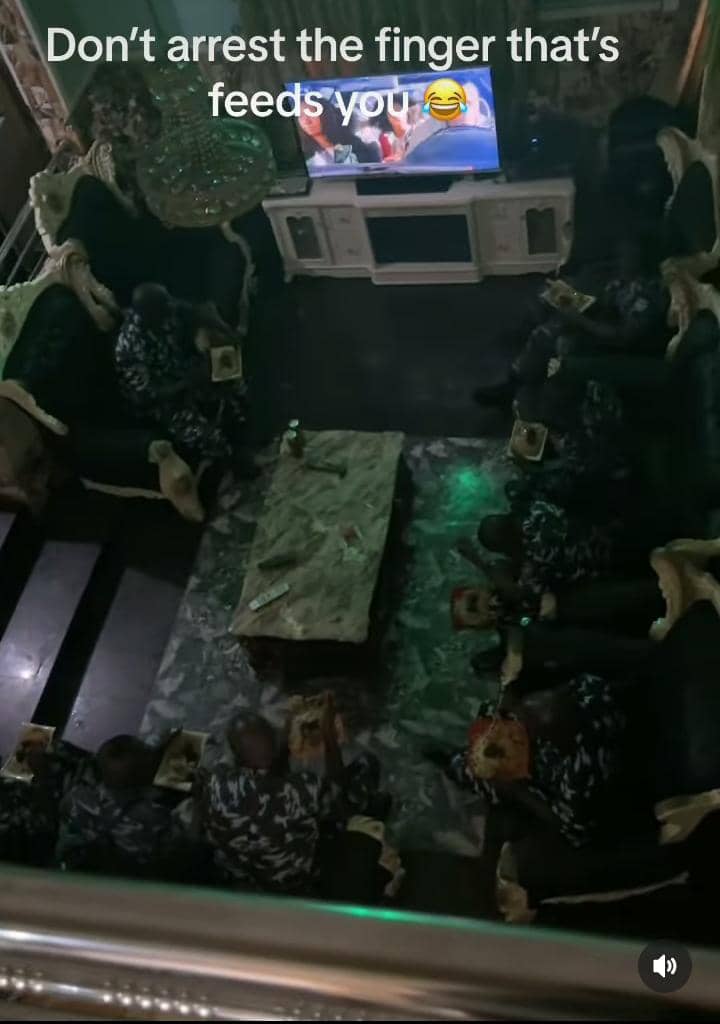 Nigerian big boy shows off police squad eating Sallah rice at his house