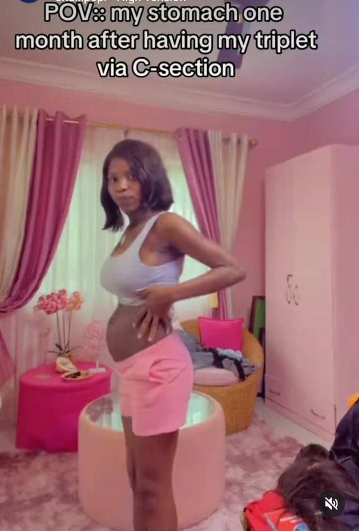 Lady shows off her stomach one month after giving birth to triplets via C-section
