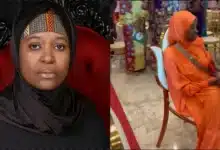 Aisha Yesufu refuses to stand during recitation of new national anthem