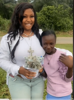 Lady emotional as her little sister gives bouquet of N50 notes as graduation gift