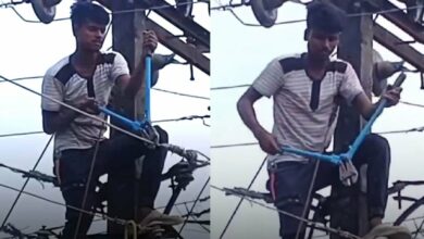 Man climbs electric pole, cutting off power supply to entire village over girlfriend's refusal to pick up his call.