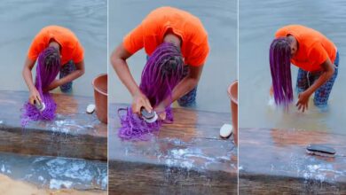 Lady spotted using hard brush to scrub her braids