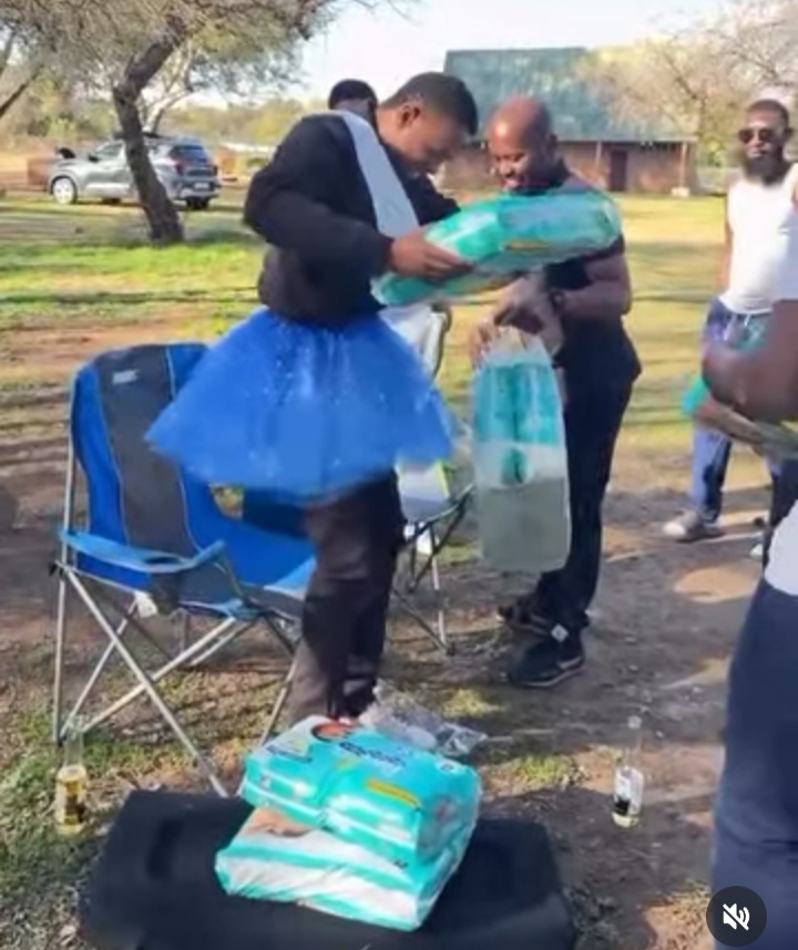 Moment group of men throw baby shower for their expectant friend 