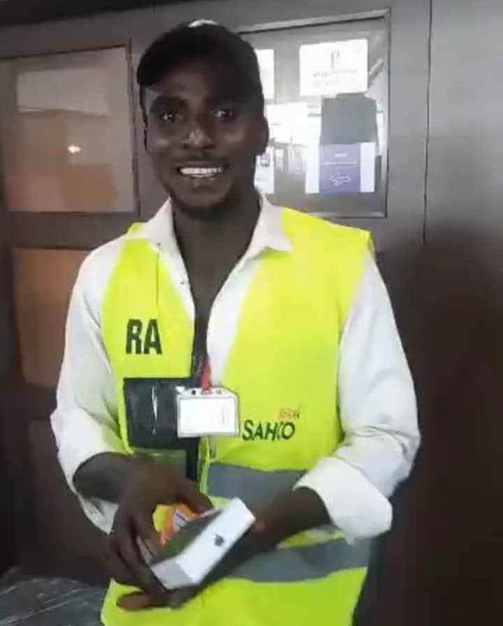 Airport staff celebrates as VeryDarkMan gifts him iPhone after boss smashed his phone during filming