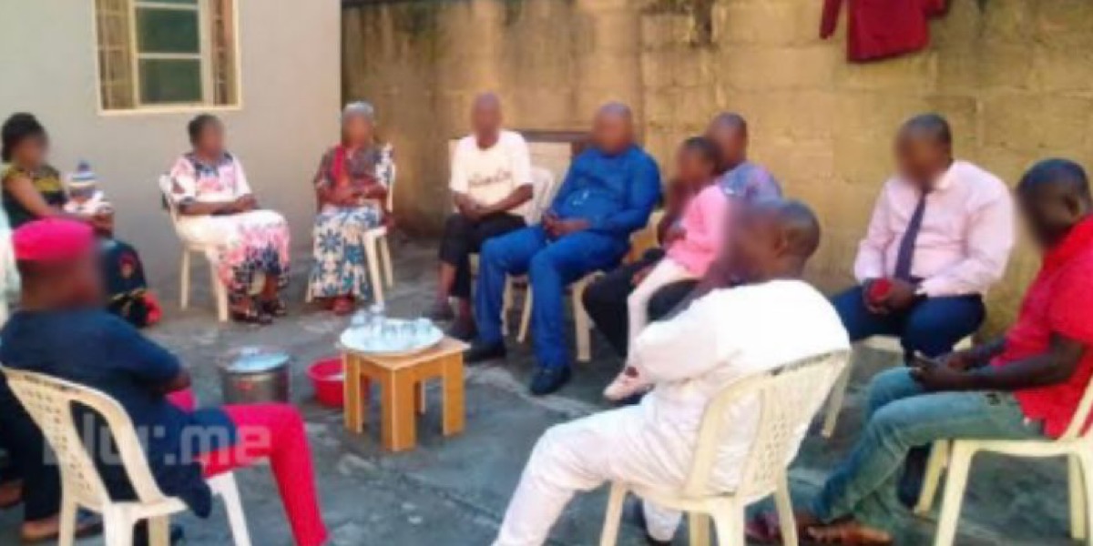 Lady travels home to report husband over nonchalance; family holds meeting, husband dozes off in front of them