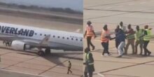 Drama at airport as man attempts to sneak between aircraft tyres to escape to the US