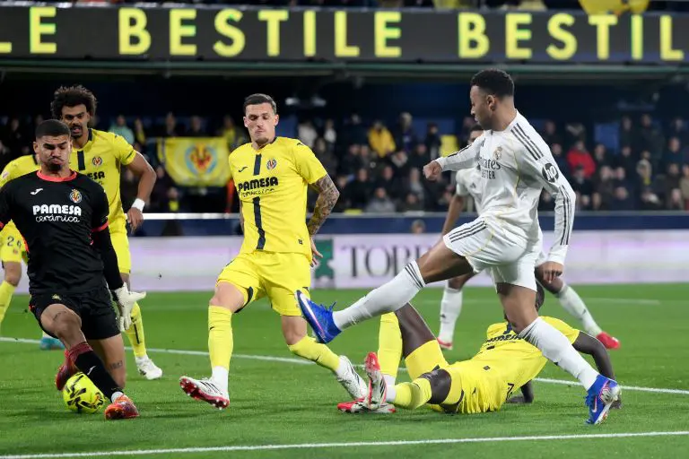 Mbappé double sends Real Madrid top of La Liga