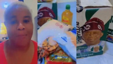 "I will..." - Woman displays Tinubu's gift box in viral video, says it won't influence her vote