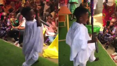 Primary school boy steals spotlight at school event as he perform his own song