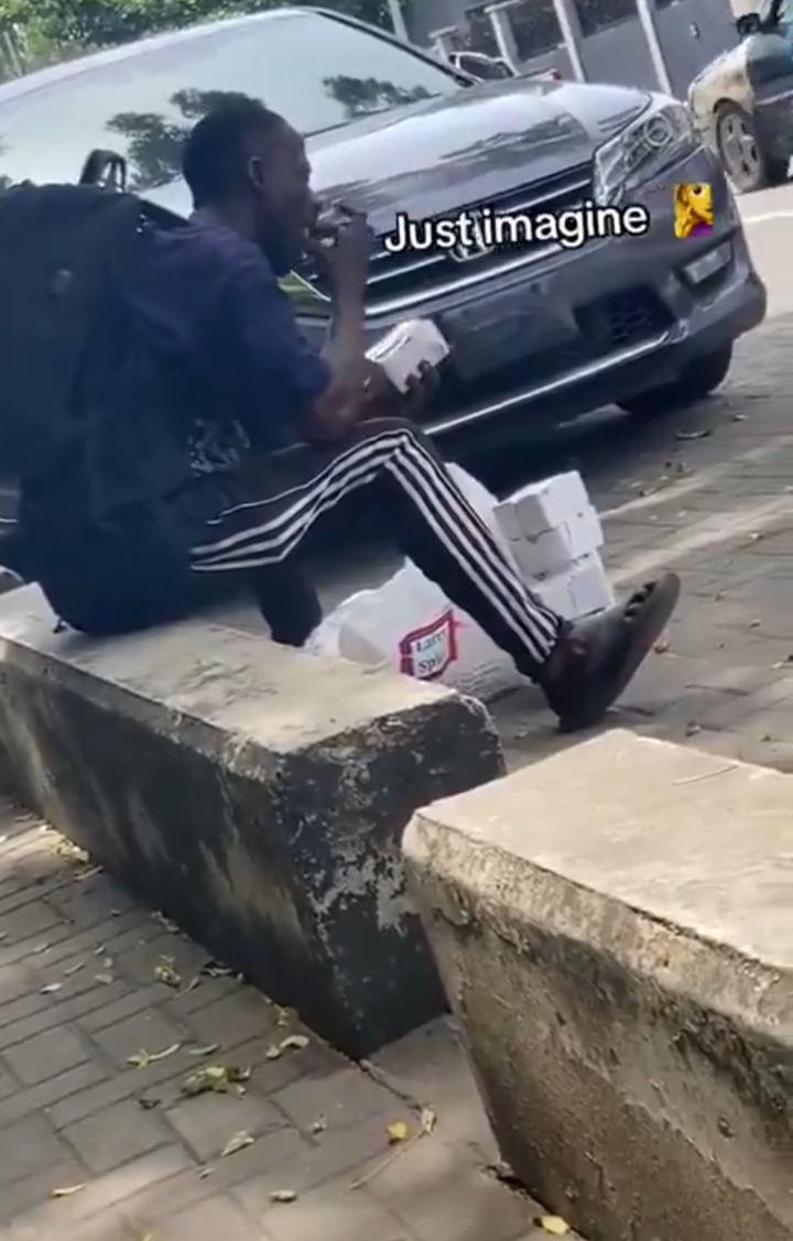 Dispatch rider eating customers order