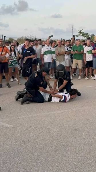 Spain opens disciplinary case over police treatment of Barcelona fan