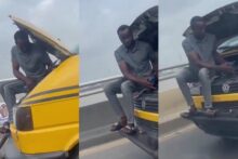 Unusual scene as man is spotted fixing moving bus while passengers remain inside in Lagos